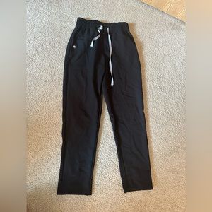 FIGS black Livingston scrub pant with snap button and zipper